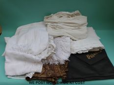 A quantity of table linen to include table cloths, runners etc,