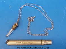 A white metal pendant and an Idris Lime Juice pair of collapsible scissors in case