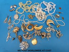 A collection of costume jewellery to include silver, costume brooches including marcasite,
