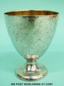 A French white metal pedestal goblet with gilt wash interior and French silver marks,