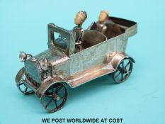 Chinese white metal model of a car with ivory headed driver and passenger and glass light, length 8.