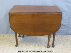 A 19th century mahogany Pembroke table raised on turned tapering legs and pad feet (L91 x min W50