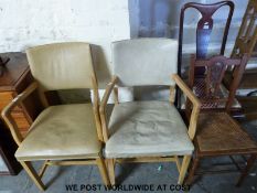A pair of retro armchairs and two other chairs
