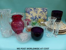 A collection of cranberry glass, cut glass retro dishes, placemats etc.