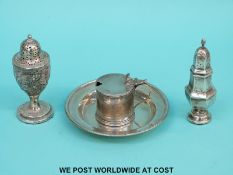 Two silver peppers and a mustard (the peppers with weighted bases) and a white metal dish with