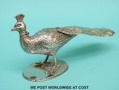 A Victorian hallmarked silver novelty scent bottle formed as a peacock with hinged head,