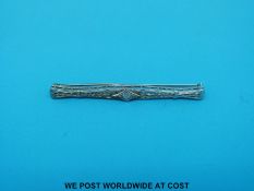 A white metal brooch set with a diamond in an Art Deco design (3g all in) and a pair of yellow