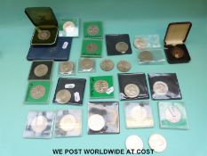 A collection of coins to include a silver example and a Winston Churchill medal together with a