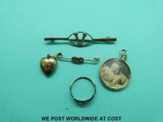 A 15ct gold heart pendant set with diamonds and ruby, two Edwardian brooches set with seed pearls,