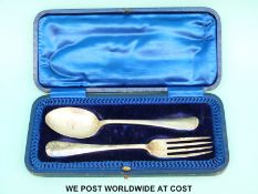 A cased hallmarked silver rat tail fork and spoon,