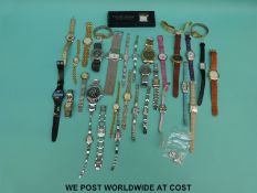 Over 30 various ladies and gentleman's wristwatches some Swatch style.