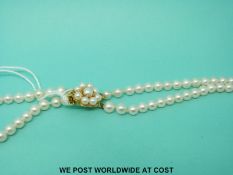 A two strand pearl necklace with 9ct gold clasp