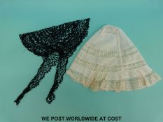 A Victorian lace ladies cap with floral decoration to the bands together with a similar black lace