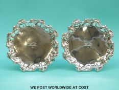 A pair of Georgian hallmarked silver salvers or card trays, having shaped edge,