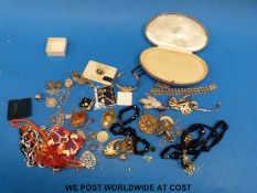 A collection of silver jewellery to include necklace, gate bracelet and pendants, costume jewellery,