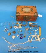 A white metal brooch marked Siam sterling, tigers eye pendants, silver brooches, white metal bangle,