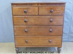 A 19thC oak chest of two over three drawers with turned handles and legs (W110 x D53 x H120cm)