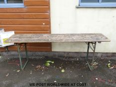 A vintage collapsible wooden table (H77cm x W220cm x D51cm)