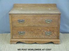 An oak two drawer chest of drawers with decorative moulding to rim (W85 x D46 x H60cm)