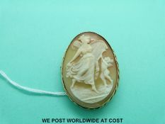 A 9ct gold brooch set with a cameo depicting a woman and cherub