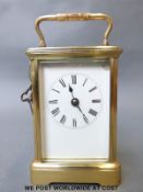 A 20th century brass carriage clock, the keywind movement striking on a gong,