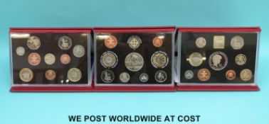 Three deluxe UK proof coin sets comprising 1999, 2001,