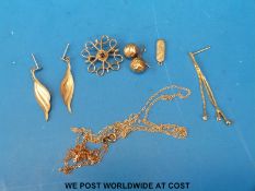 A 9ct gold brooch set with a sapphire, two pairs of yellow metal earrings,