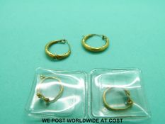 Two pairs of Roman yellow metal hoop earrings