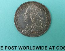 A 1757 George II six pence in VF-EF condition