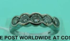 An 18ct white gold ring set with five round cut diamonds, the largest approximately 0.