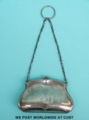 A hallmarked silver purse with silk division, Birmingham 1910 maker Charles S Green, width 9.