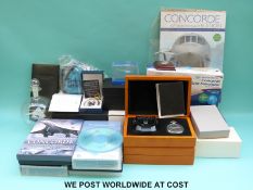 A quantity of Concorde collectables including pocket watches, paperweight, simulator,