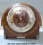 A circa 1930's Art Deco style mantel clock with decorative inlay,