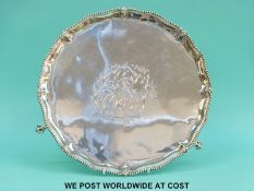 A large Georgian hallmarked silver with shaped and beaded edge, raised on three ball and claw feet,