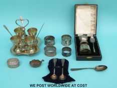 A cased hallmarked silver christening set comprising egg cup, spoon and napkin ring,