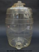 A glass bar top barrel drinks dispenser with graduations marked to side, 36cm tall.