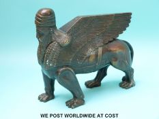 A Grand Tour 19thC bronze of an Assyrian human headed winged lion,