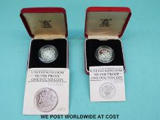 Two cased UK silver proof Piedfort £1 coins 1983 and 1984 (with proof certificates)