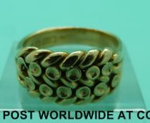 An 18ct gold keeper ring, Birmingham 1898 (9.