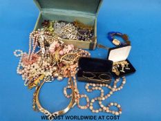 A collection of costume jewellery to include beads brooches, yellow metal glasses marked 9ct gold,