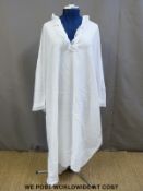 A nightdress once owned by Queen Victoria with her Royal emblem embroidered to the front of the