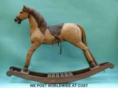 A carved wooden rocking horse,