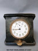 A Swiss 8 day leather cased travelling clock by Walker and Hall,