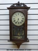 A late 19thC century American wall clock with carved and inlaid decoration together with a Dutch