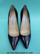 A pair of Jimmy Choo black leather stiletto court shoes, size 39, with original box, cloth bag,