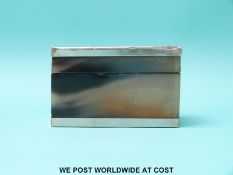 A white metal edged horn or similar box