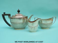 A Georgian V hallmarked silver three piece tea set with fluted decoration,