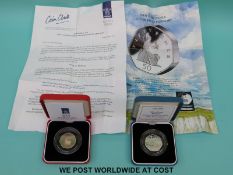 A 1994 silver proof piedfort 50 pence coin together with a 1997 reduced size example,