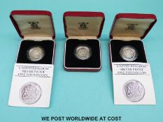 Three cased Royal Mint £1 silver coins for 1983,