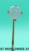 A Victorian stick pin set with a star sapphire cabochon